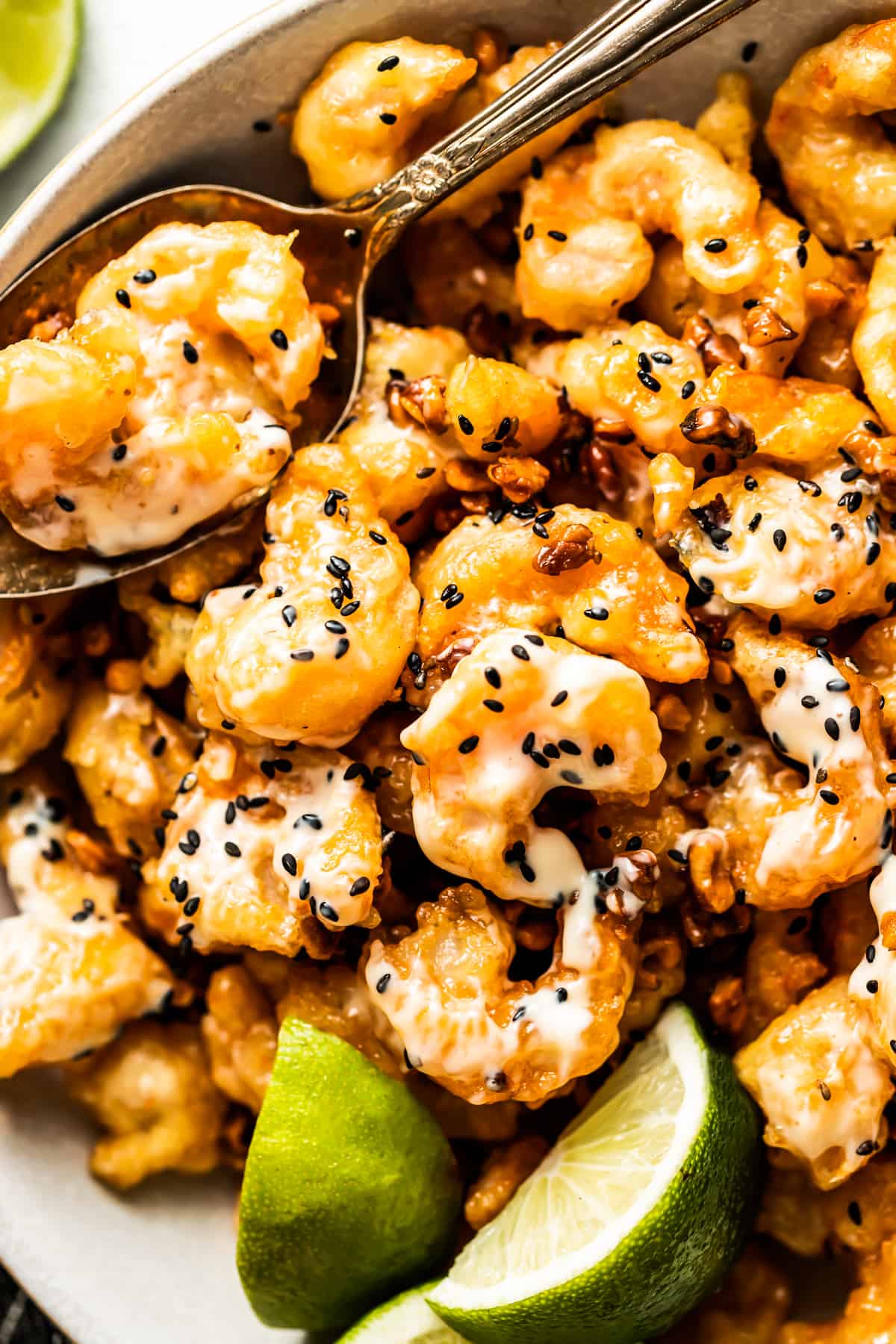 Close-up photo of honey walnut shrimp with sesame seeds.