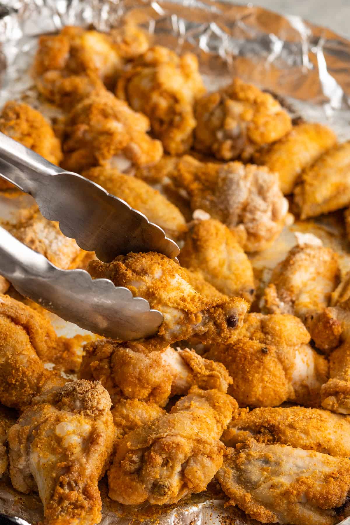 These garlic Parmesan chicken wings are crispy, juicy, and tossed in a buttery garlic Parmesan sauce. They’re easy to make right in the oven!