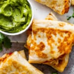 breakfast quesadillas with red pepper and cilantro served with guacamole