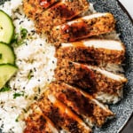 Close-up of chicken katsu with tonkatsu sauce over rice.