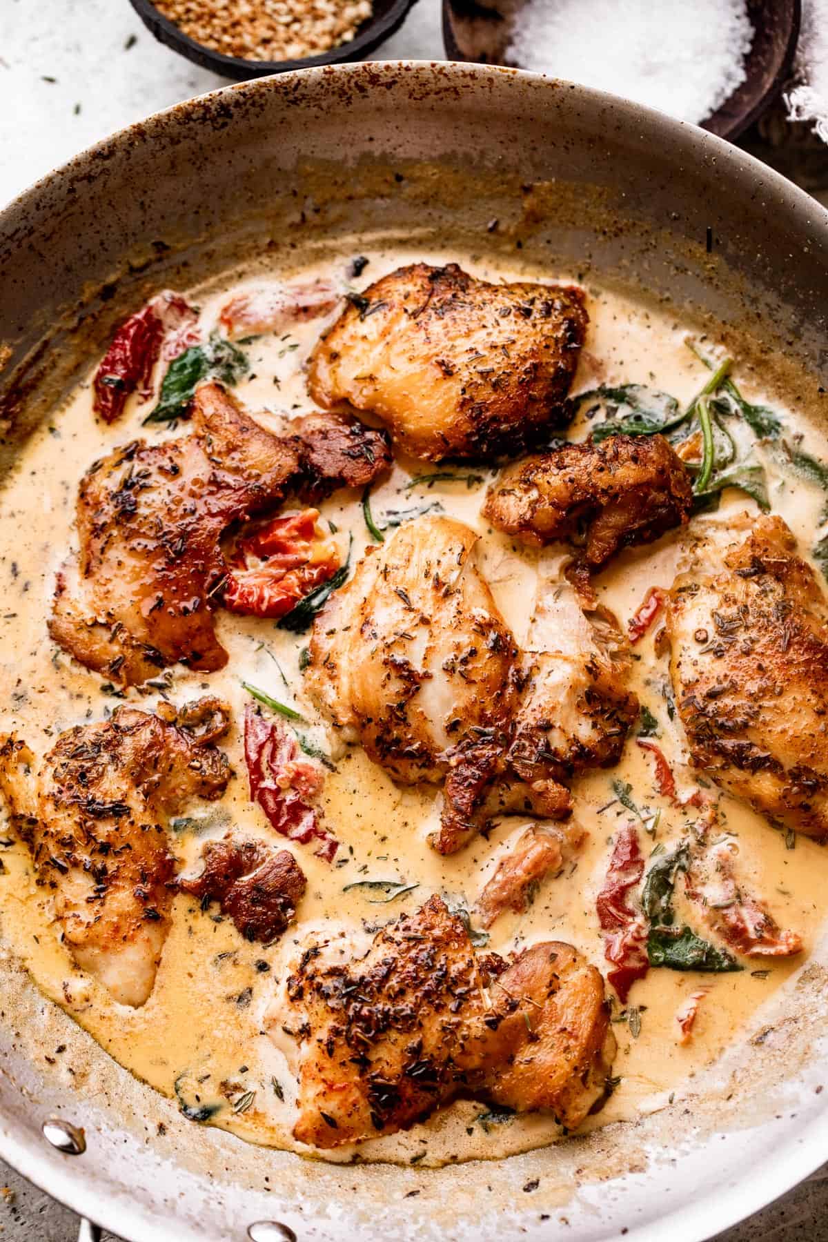 Sun Dried Tomato Chicken cooking in a skillet.
