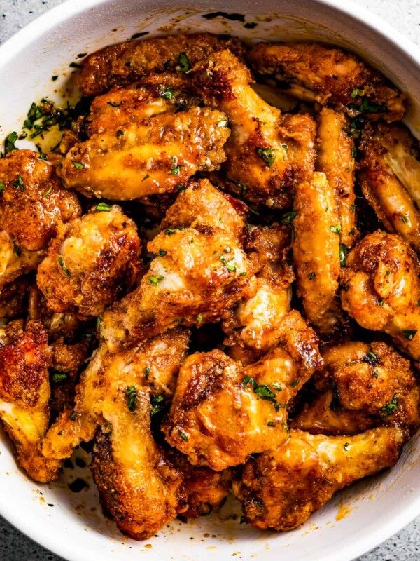 baked chicken wings in a white bowl.