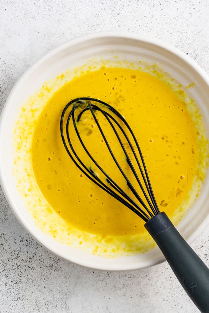 Whisked egg mixture in a bowl.