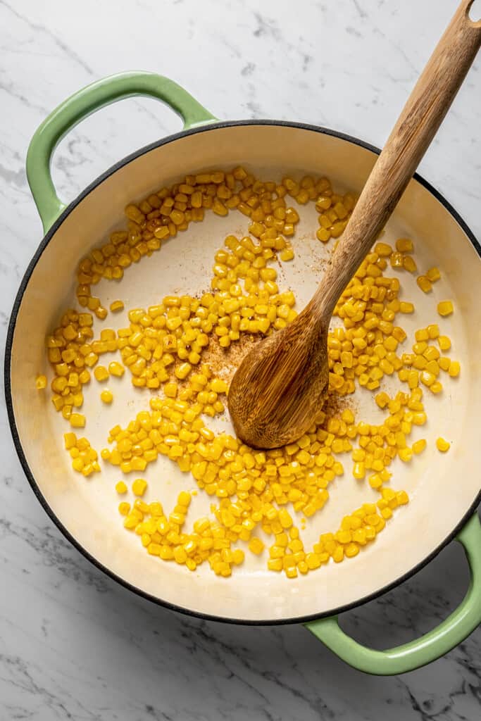 Cooking corn in a pot.