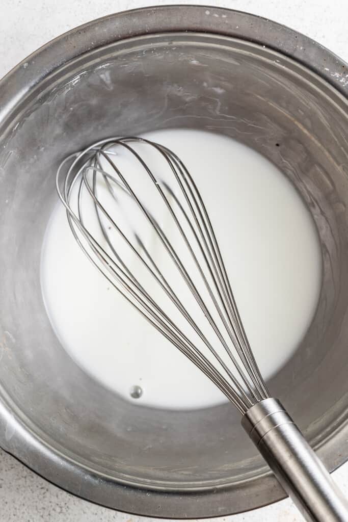 Whisking together cornstarch and water.