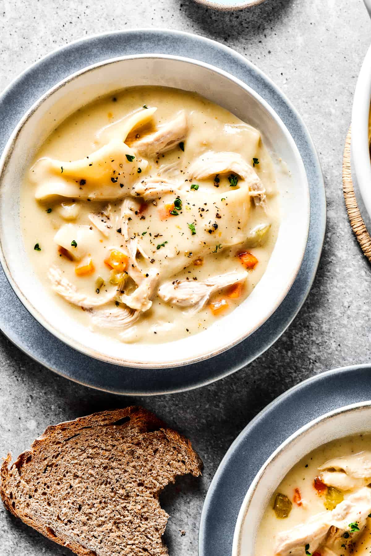 chicken and dumplings served in bowls.