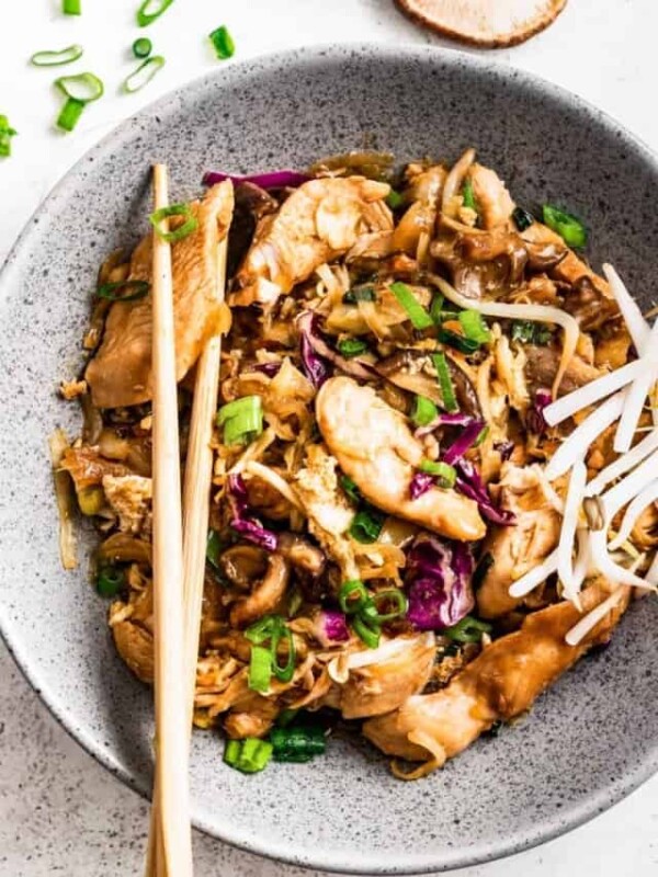 Moo shu chicken in a bowl with chopsticks.