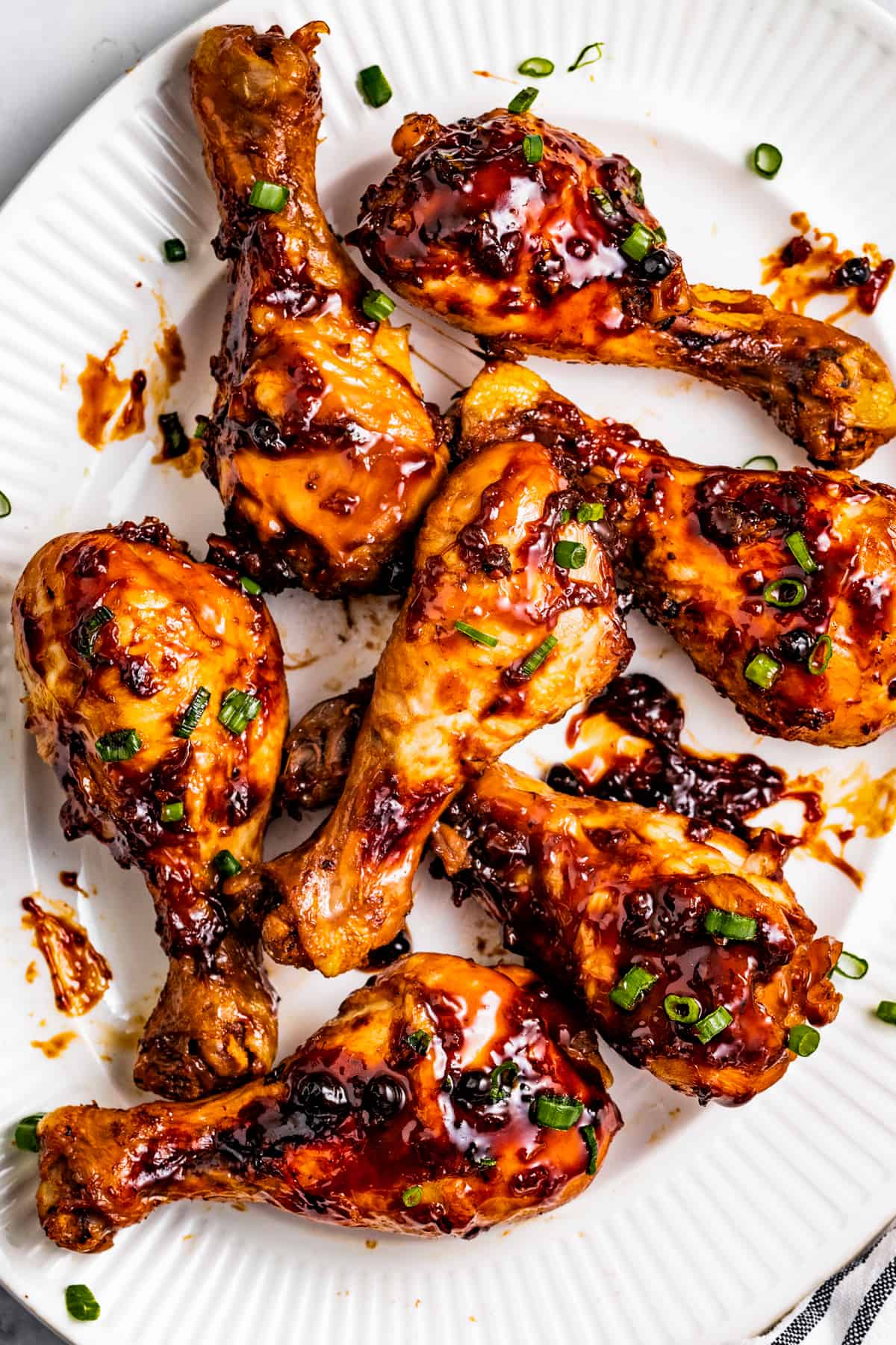 Chicken adobo drumsticks on a serving platter.