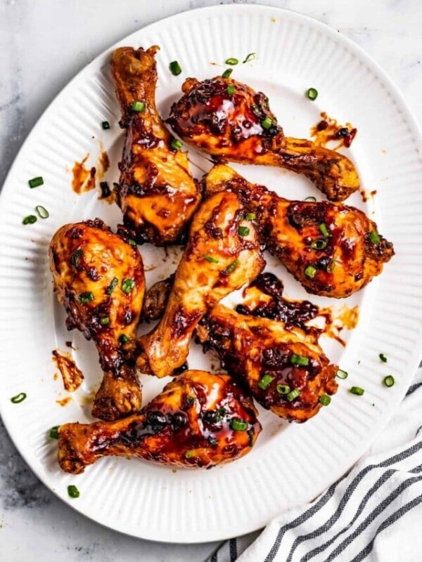 Chicken adobo drumsticks on a serving platter.