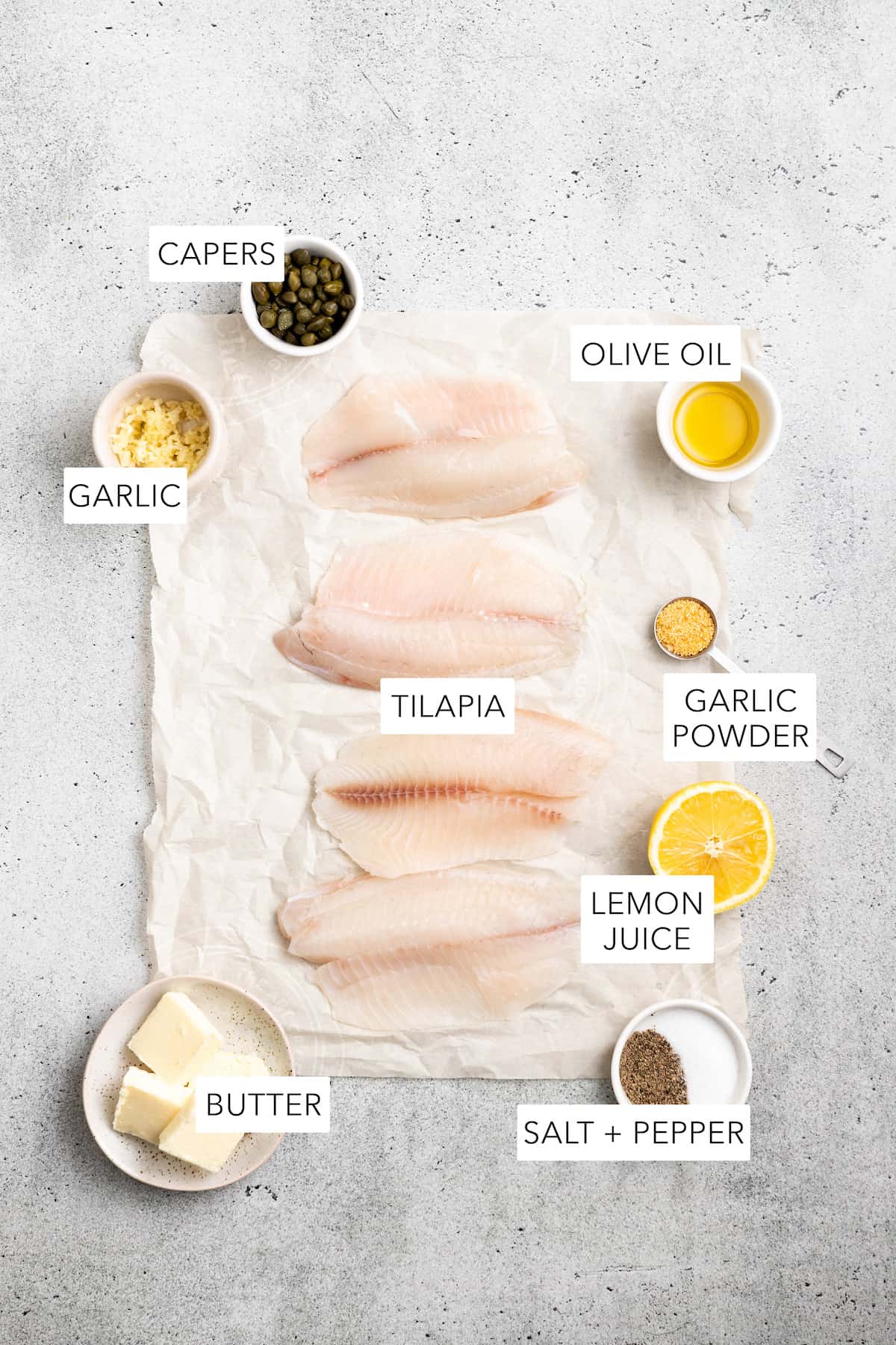 Ingredients for air fryer tilapia separated and labeled.