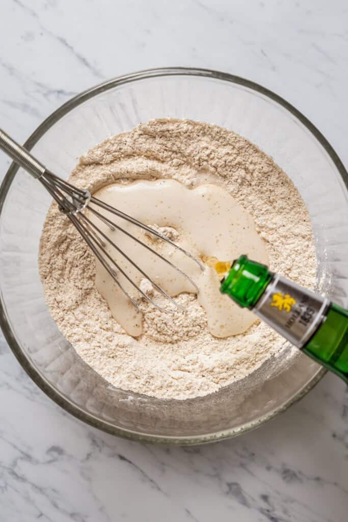 Making the beer batter in a glass bowl