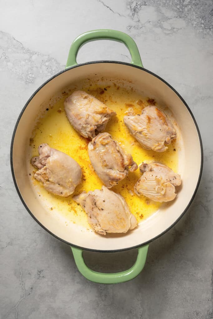 Browning chicken thighs in olive oil.