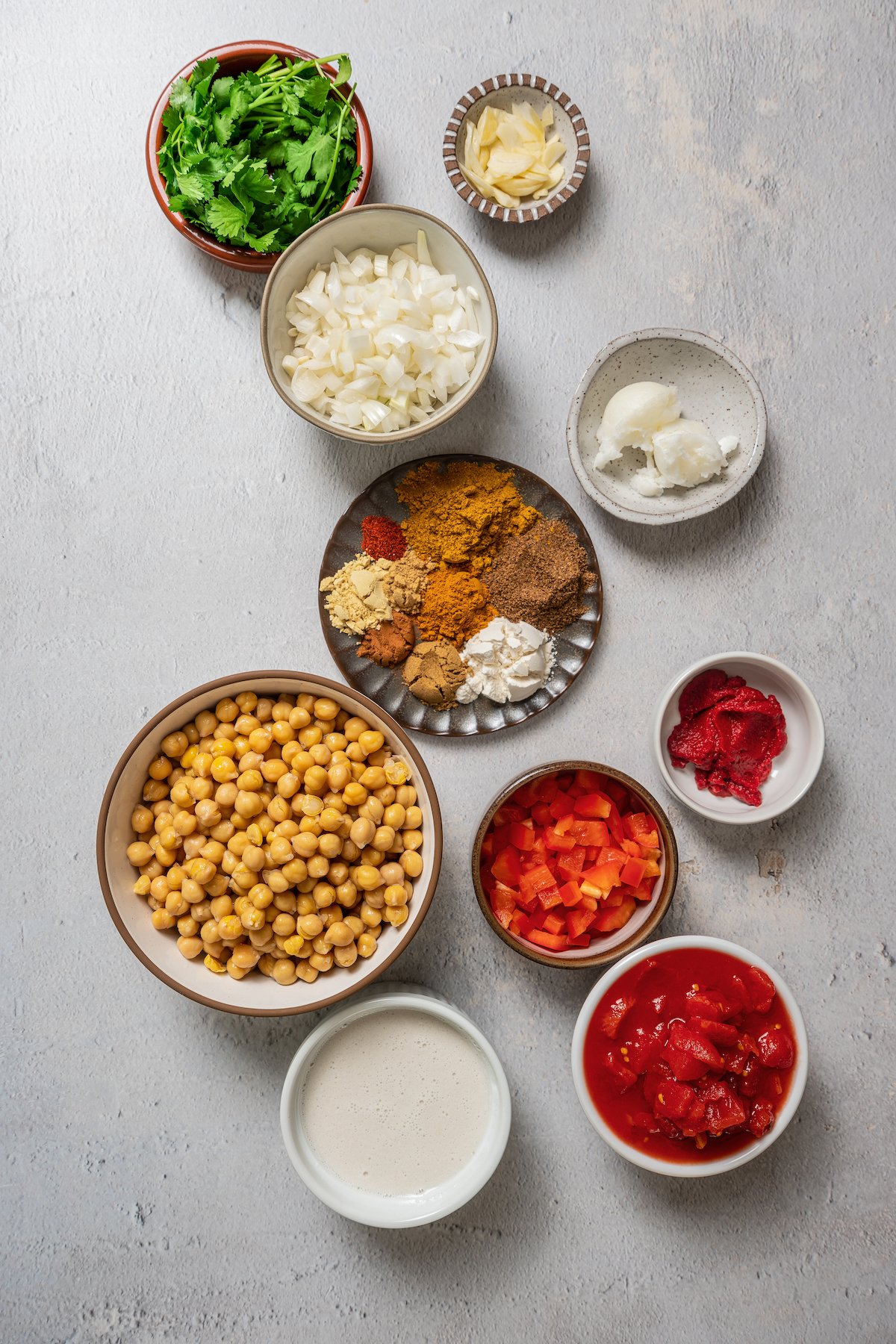 Ingredients for coconut chickpea curry separated into bowls.