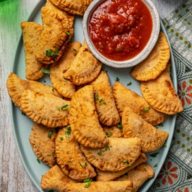 Pierogis on a plate with salsa