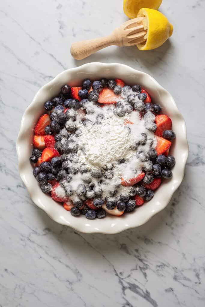 Crumble fruit filling in a pie dish