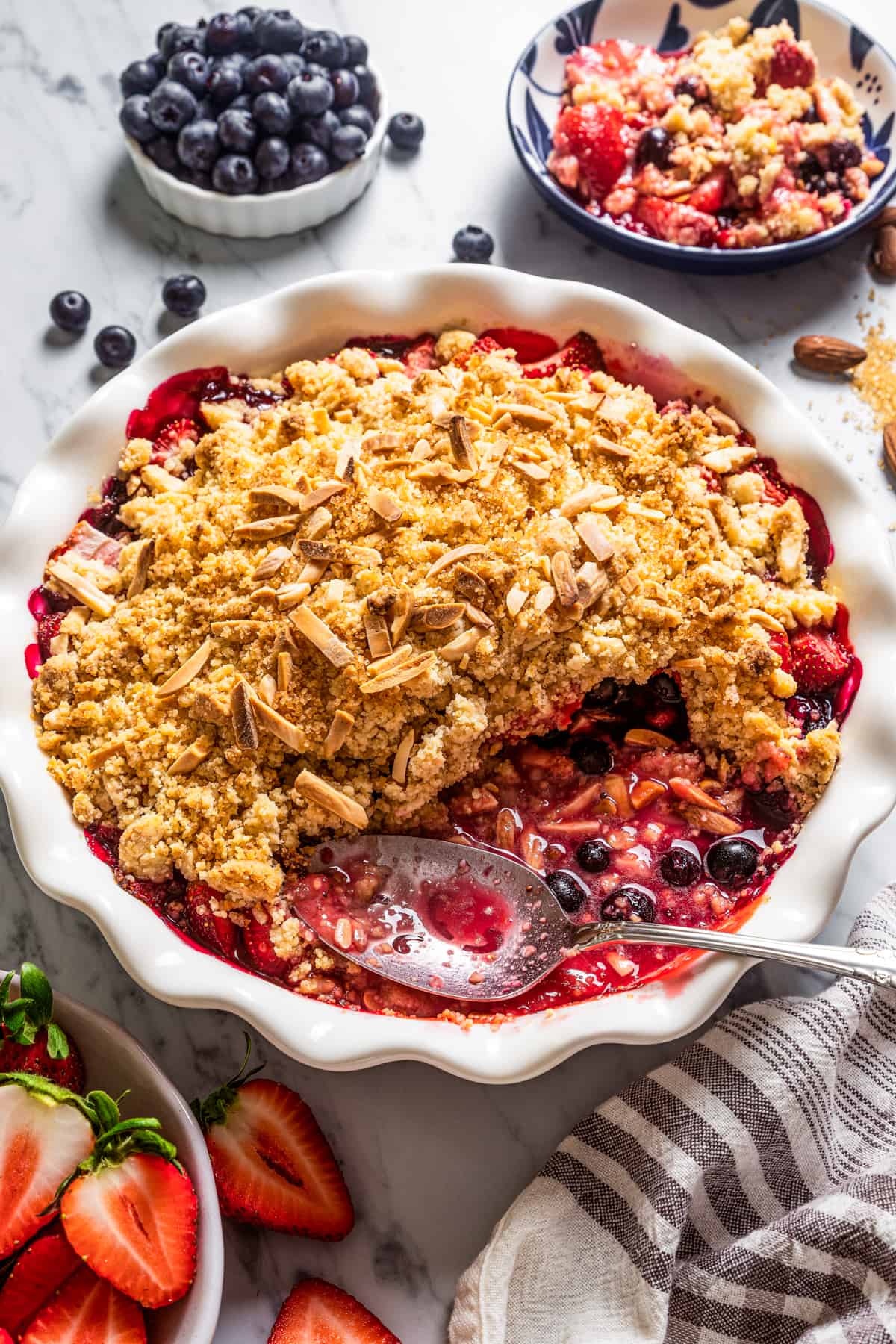 Berry Crumble with a scoop of crumble taken out of the dish.