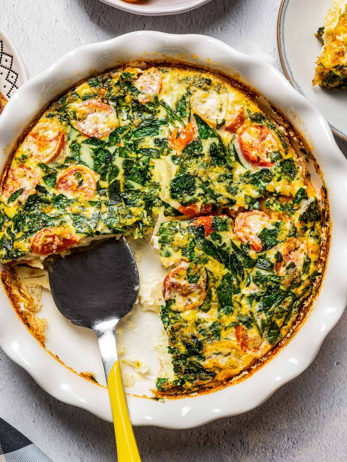 Serving egg white frittata with a spatula.