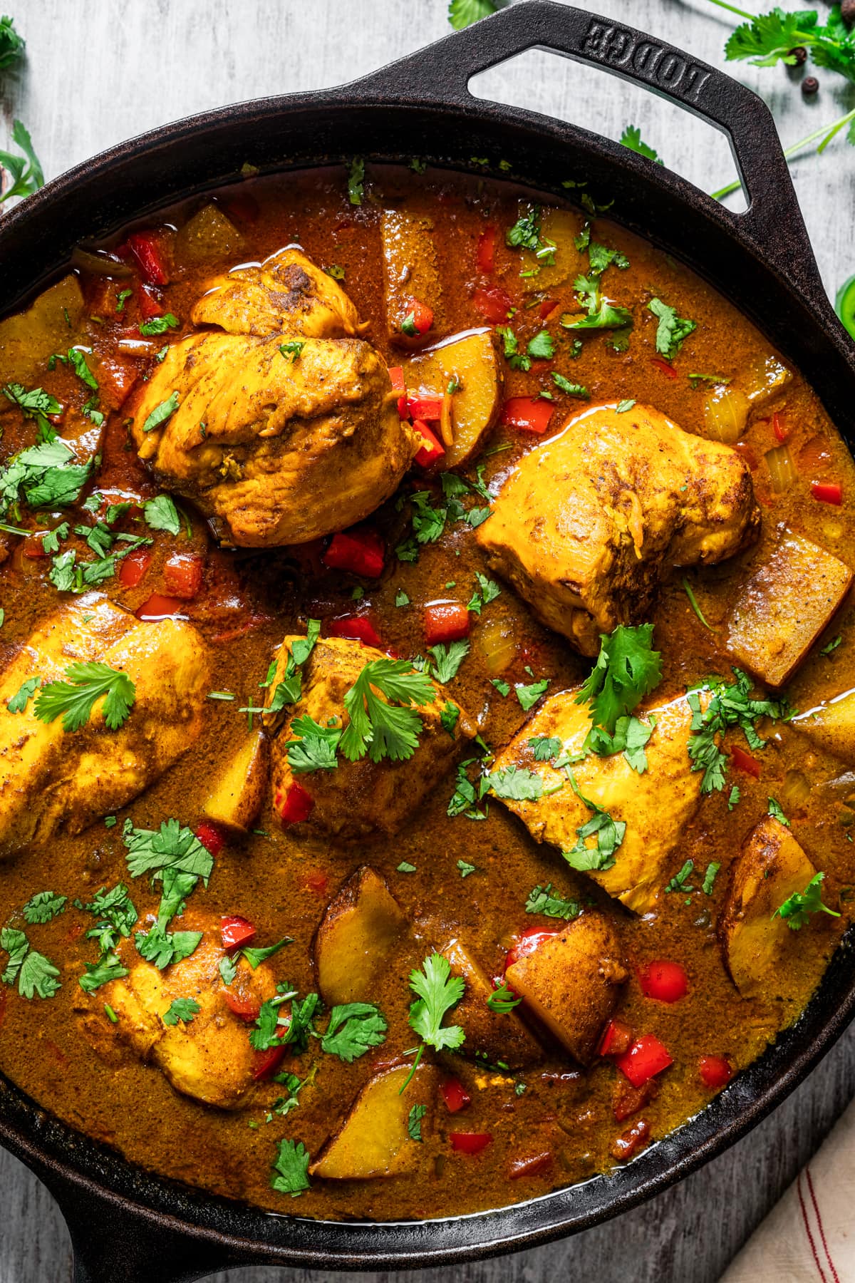 Jamaican curry chicken in a pan.