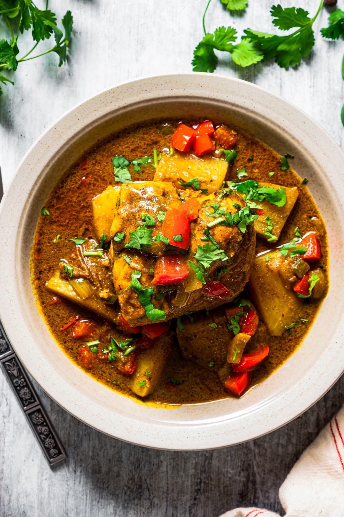 Jamaican curry chicken in a bowl.