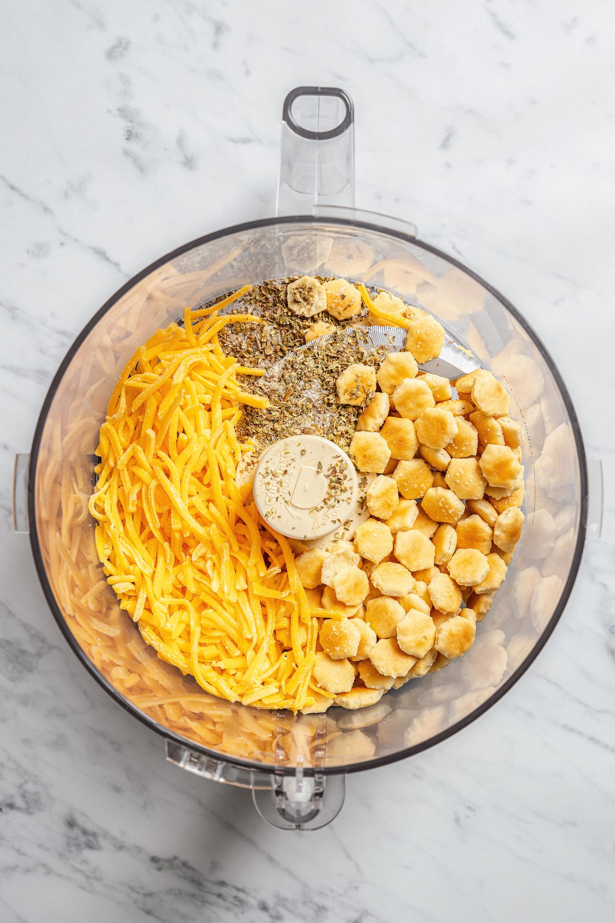 This crispy breaded pork chops recipe is an easy dinner, with juicy boneless pork chops coated in crunch and baked in the oven until golden. Adding the ingredients for cheddar-infused breading to a food processor.
