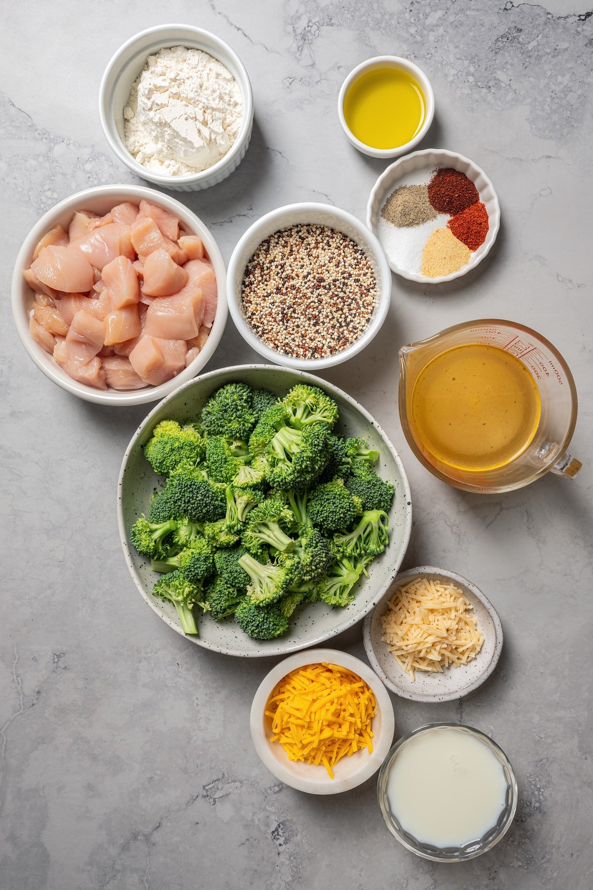 Ingredients for chicken and broccoli casserole separated into bowls.