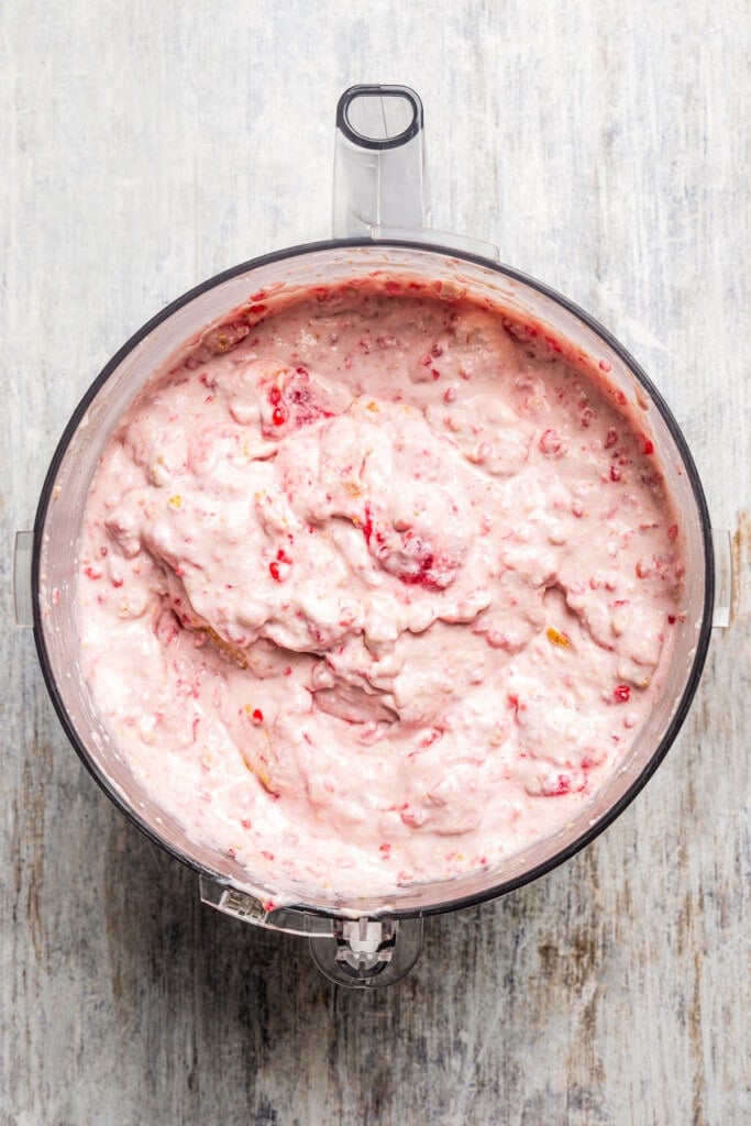 Raspberry cottage cheese ice cream in a blender ready to be chilled.