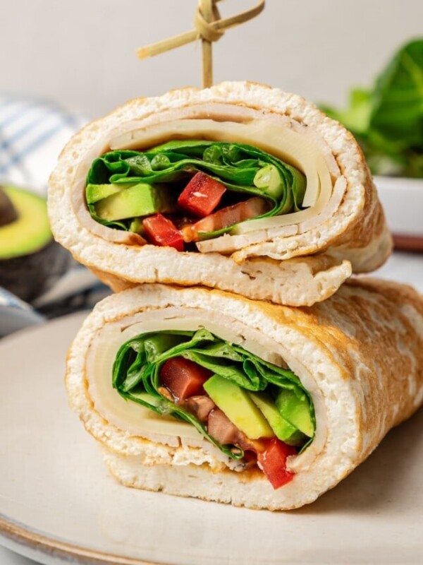 Two halves of an egg white wrap stacked on top of each other.