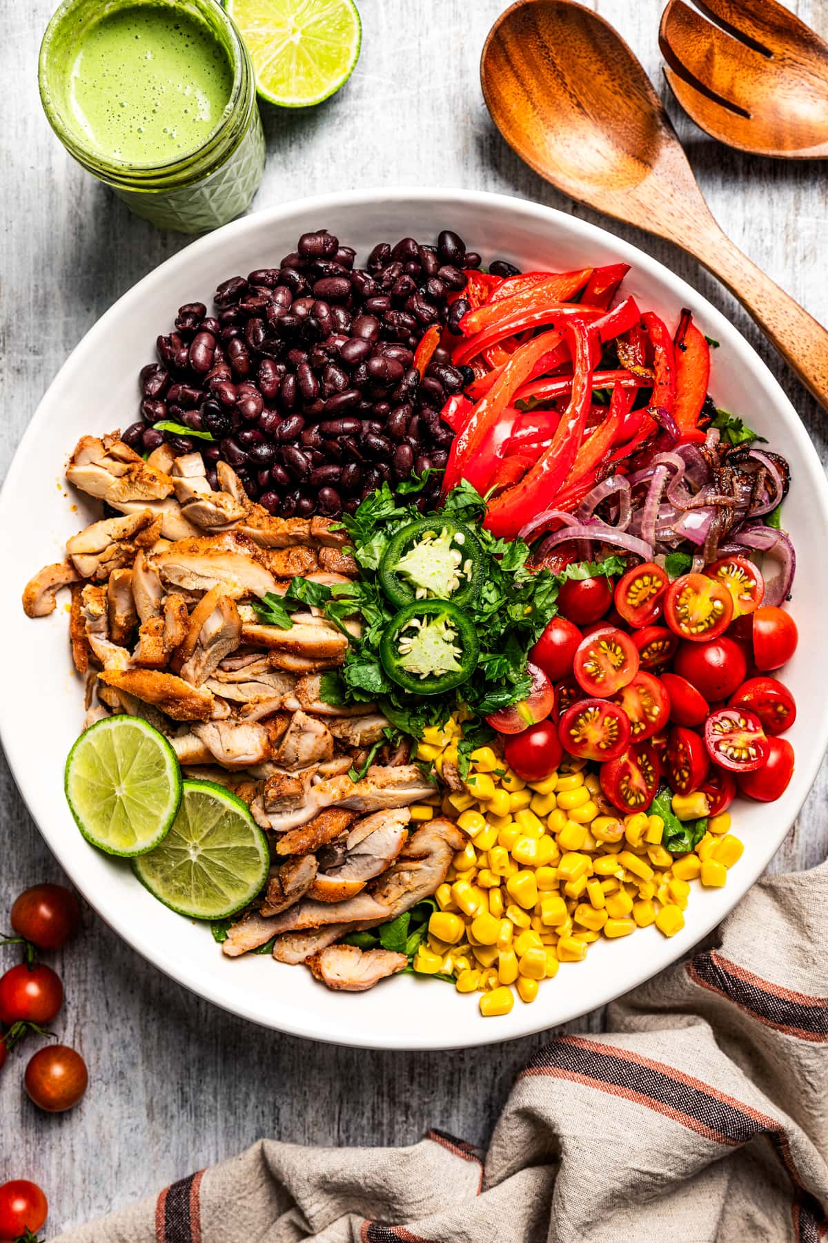Overhead image of ingredients for a southwestern salad arranged in a bowl before dressing and tossing.