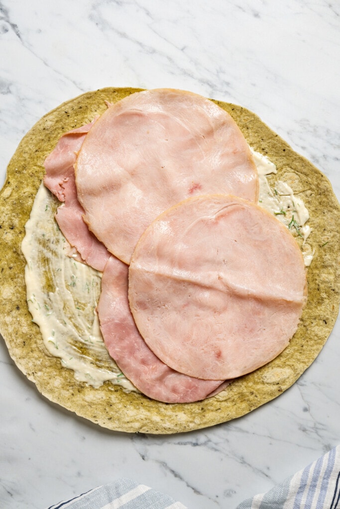 Adding deli turkey meat along with ham to a wrap spread with dijon-dill mayo.