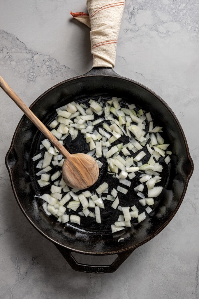 Sauteing onions in a skillet.