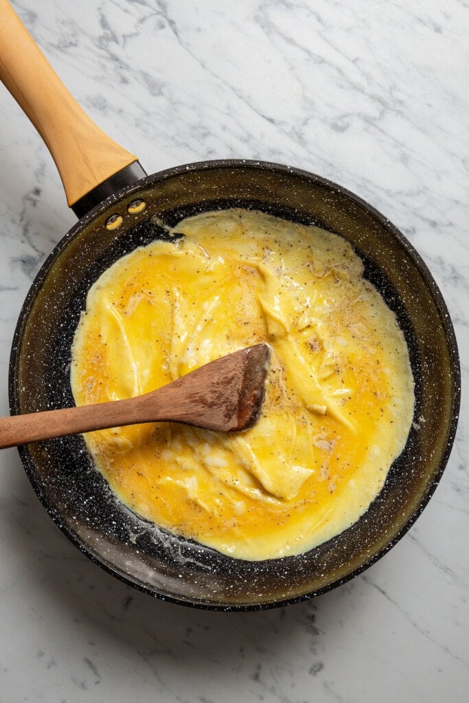 Making the egg "pancake" for an omelette.