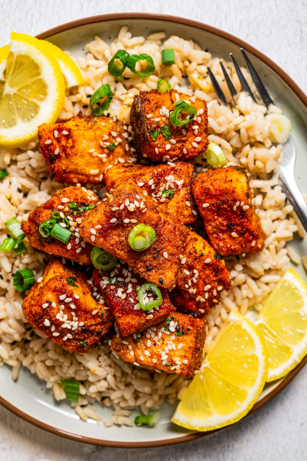 A plate of Air Fryer Salmon Bites served over rice.