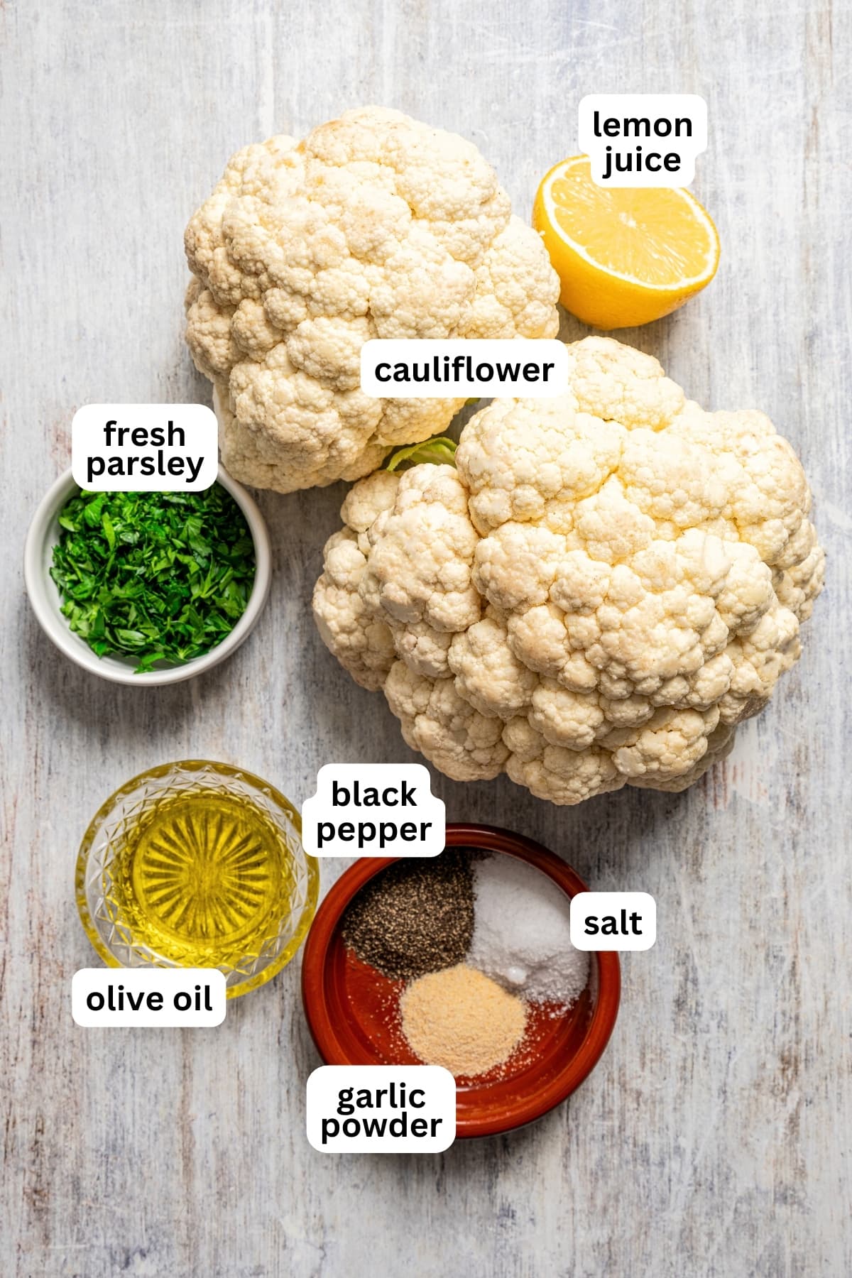 Overhead image of the ingredients used to make roasted cauliflower steaks.