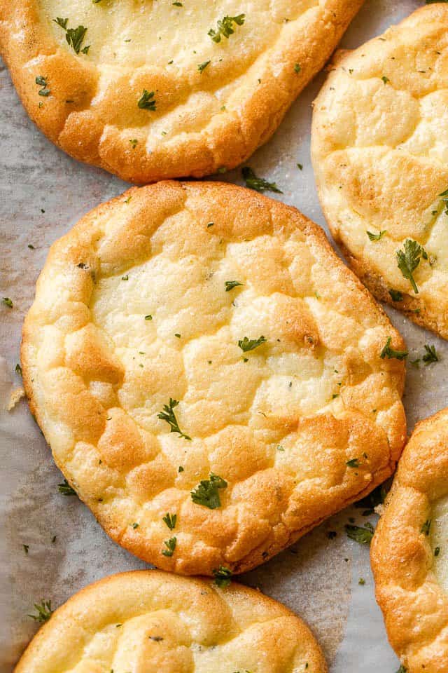overhead shot of cloud bread rounds topped with parsley