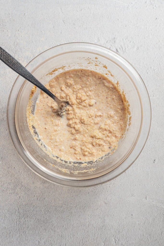 Hydrating breadcrumbs with milk.