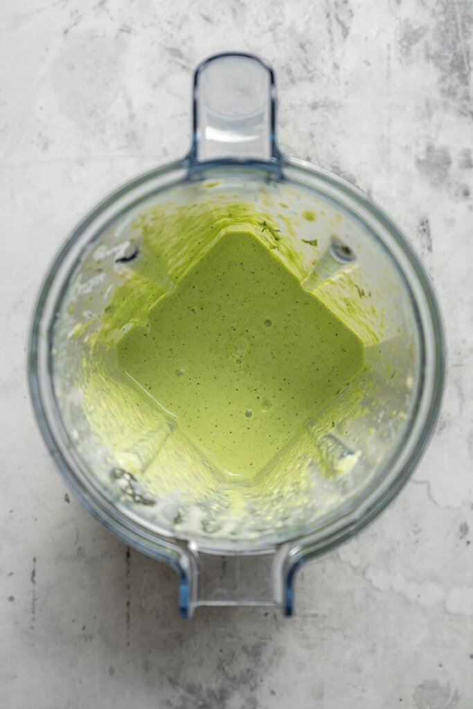 Avocado lime ranch dressing in a blender.