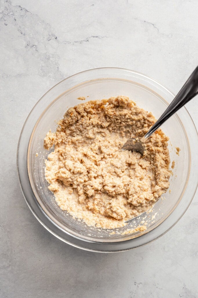 Hydrating breadcrumbs with milk.