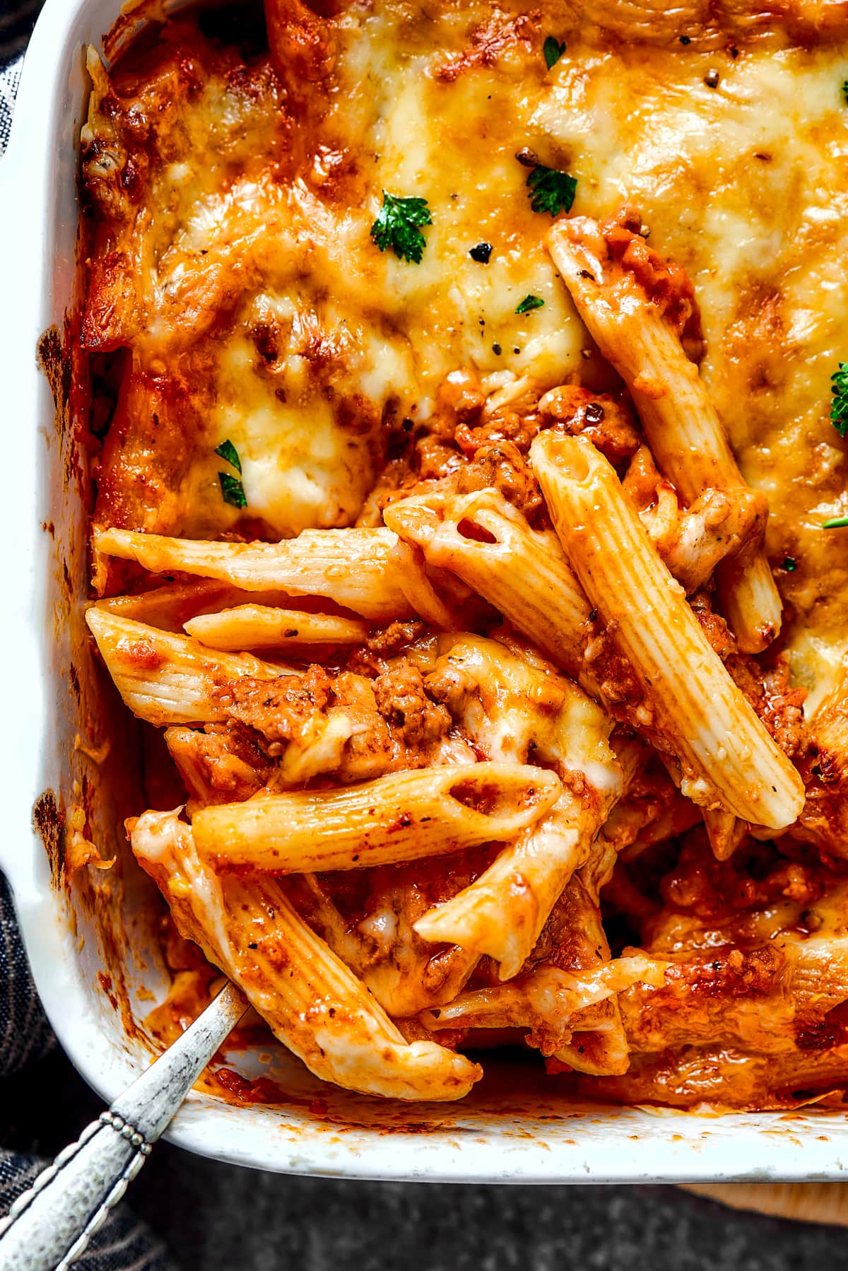 Baked Mostaccioli in a baking dish.