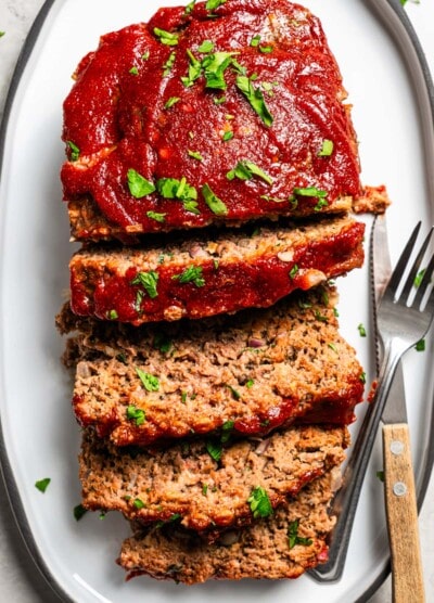 Aerial view of Lipton onion soup meatloaf served and sliced on a platter.