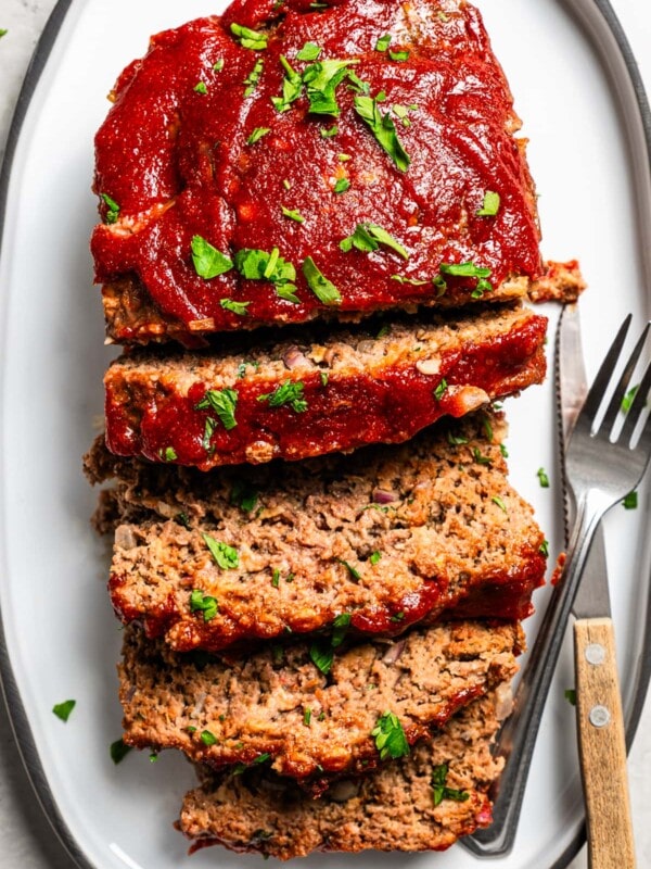Aerial view of Lipton onion soup meatloaf served and sliced on a platter.