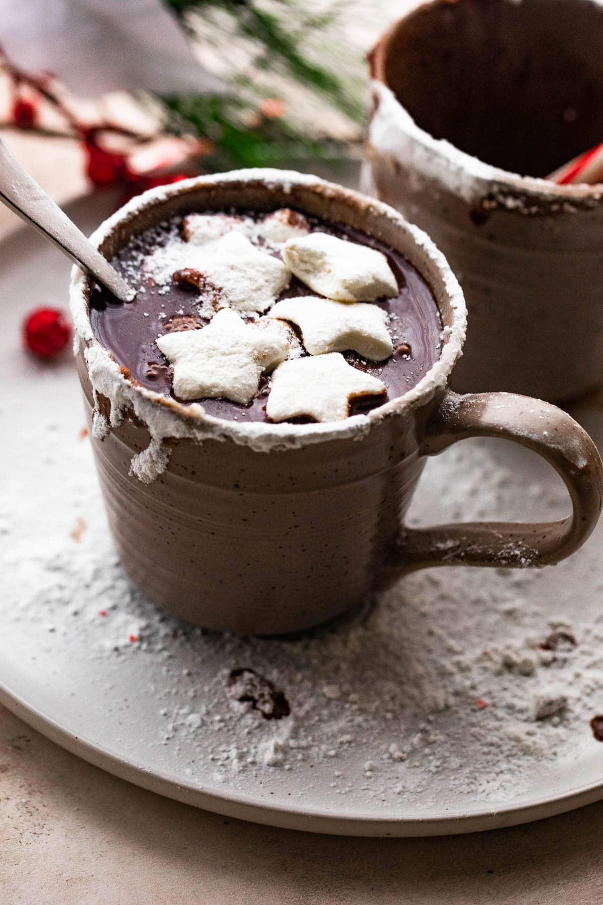 Hot Chocolate served in a mug and topped with star-shaped marshmallows.