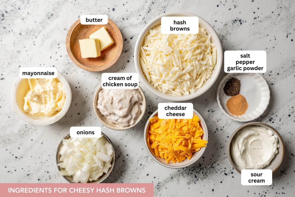 Cheesy Hash Browns combine sour cream, mayo, cream of chicken soup, hash browns, and cheddar, then bake into a golden, cheesy casserole. Ingredients for cheesy hash browns with text labels set over each ingredient.