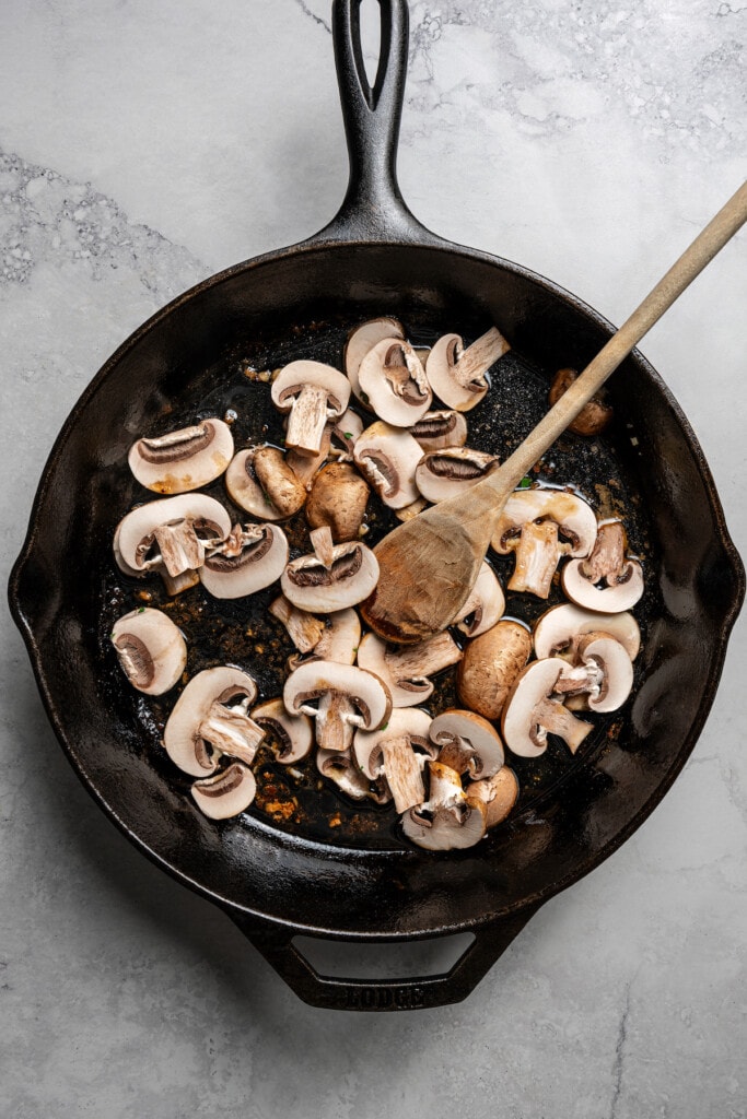 Sauteing mushrooms in butter.