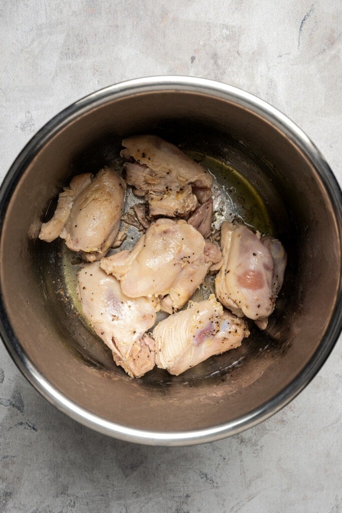 Seared chicken thighs in an Instant Pot.