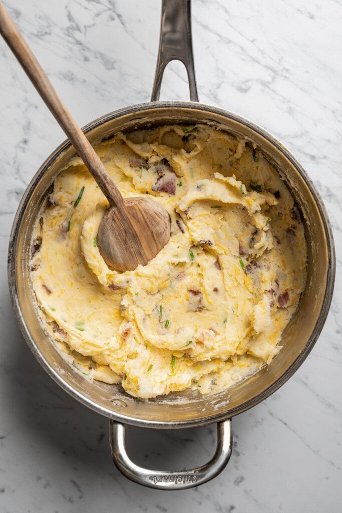 Bacon-chive-cheddar mashed potatoes in a saucepan.