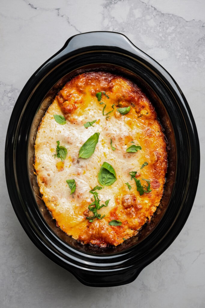 Overhead image of crockpot lasagna in a crockpot.