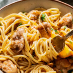 A fork twirling pasta.