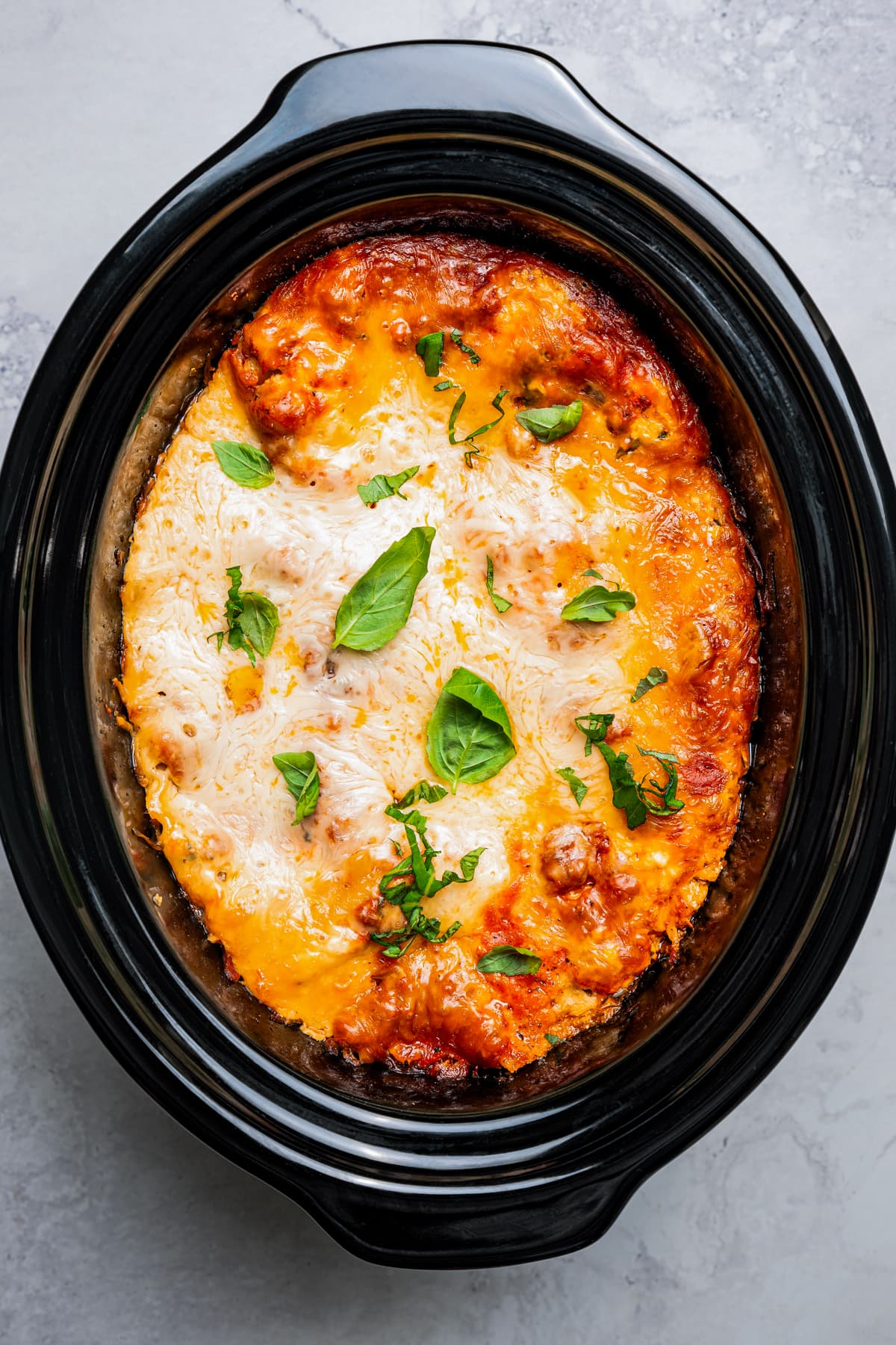 Crockpot lasagna cooking in the slow cooker.