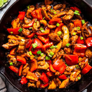 Overhead view of black pepper chicken in a skillet.