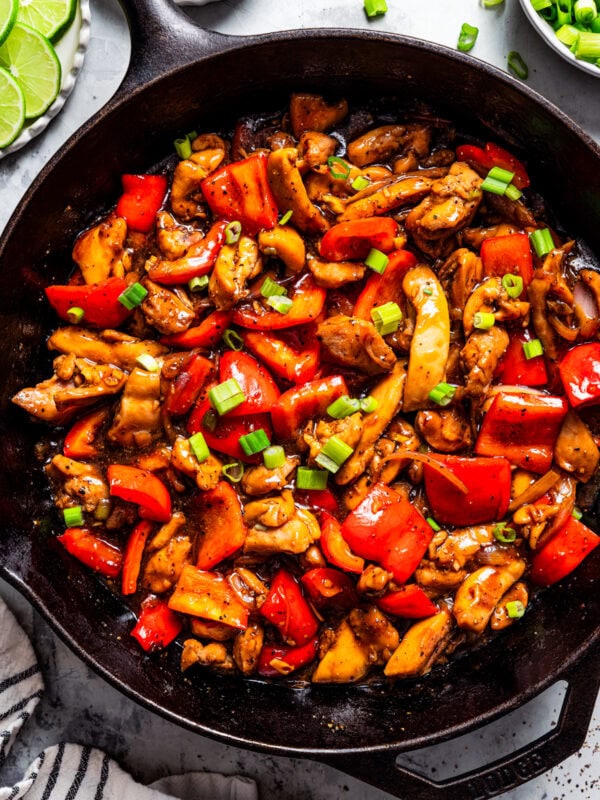 Overhead view of black pepper chicken in a skillet.